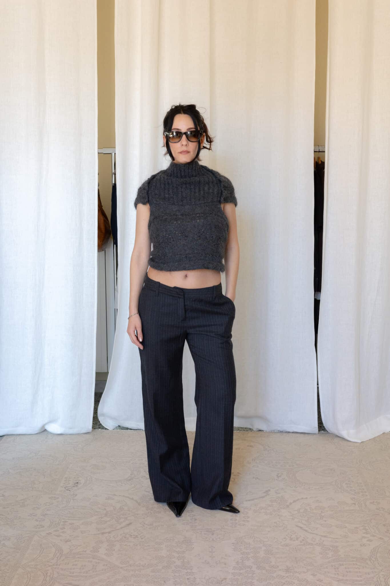 Charcoal mohair blend knit top with open back detail styled with dark grey pinstripe wide leg trousers
