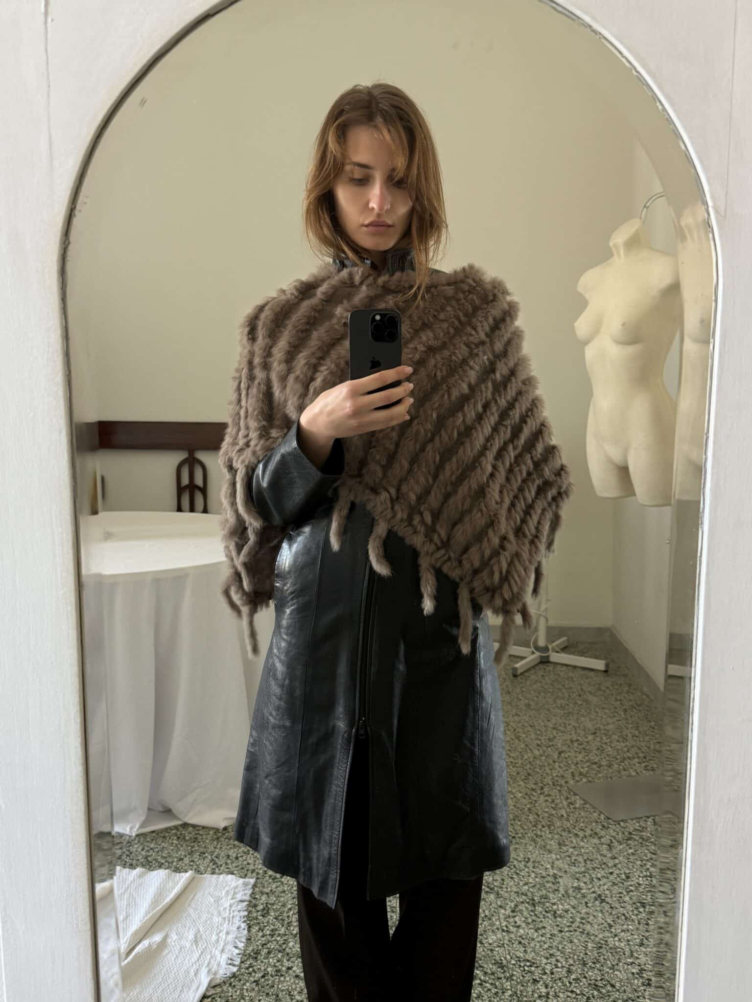 Black leather jacket with structured fit and clean front closure