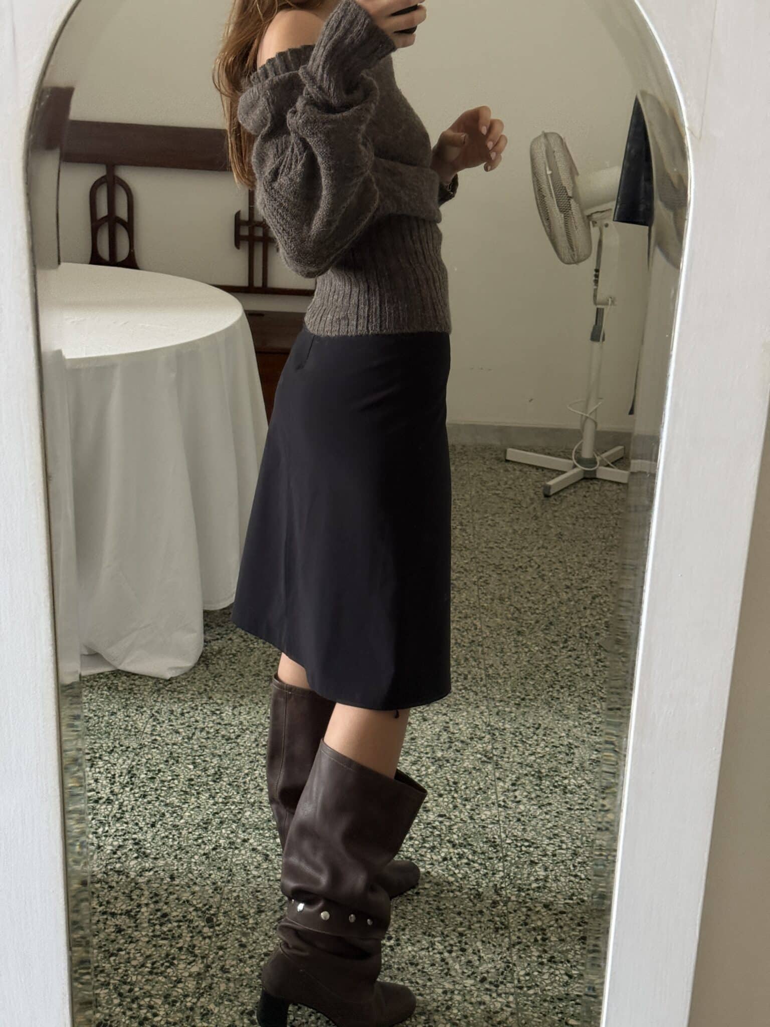 Black midi skirt with clean lines and straight silhouette