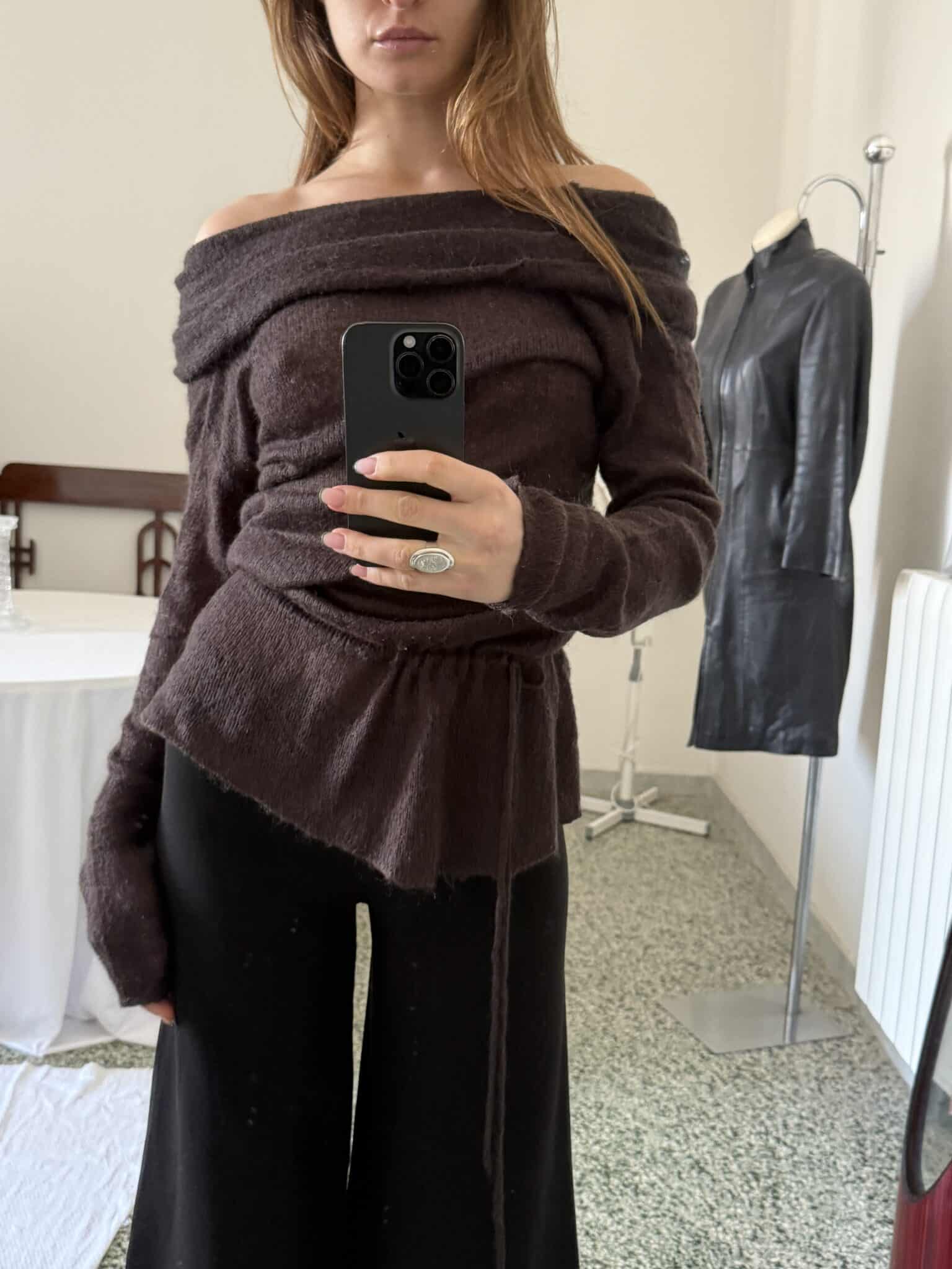 Brown knit sweater with off-shoulder neckline and wrap-style waist tie