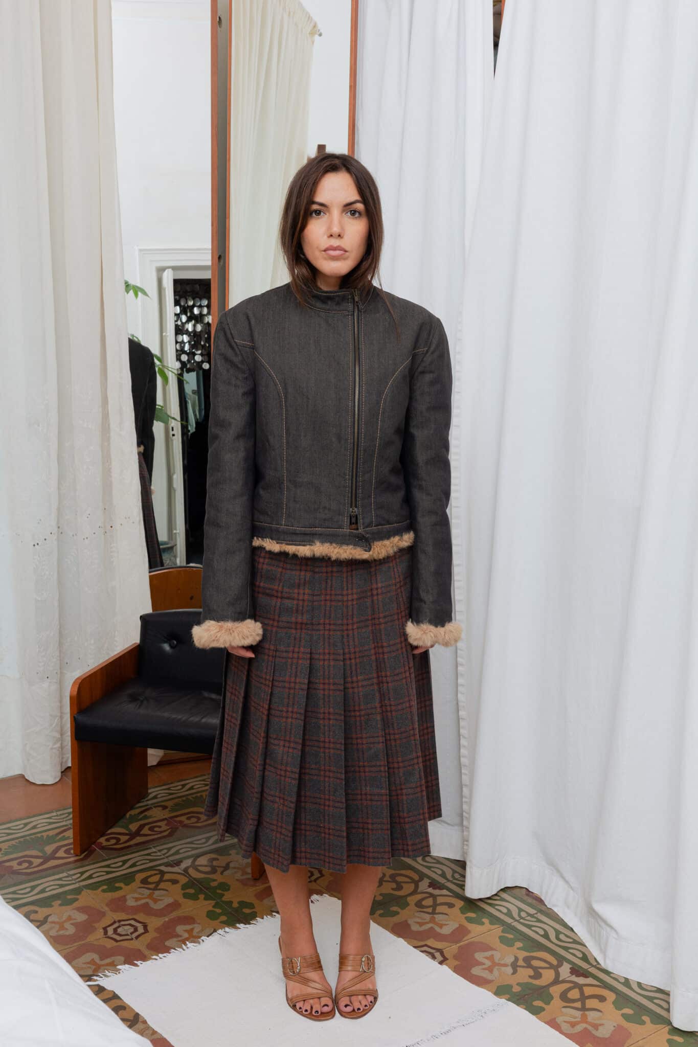 Full outfit featuring denim jacket, plaid skirt, and Adidas tank top.