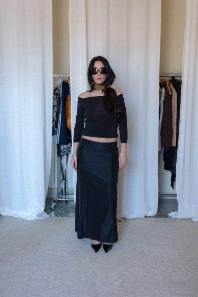 Black off shoulder top styled with a black satin maxi skirt, pointed heels and printed neck scarf