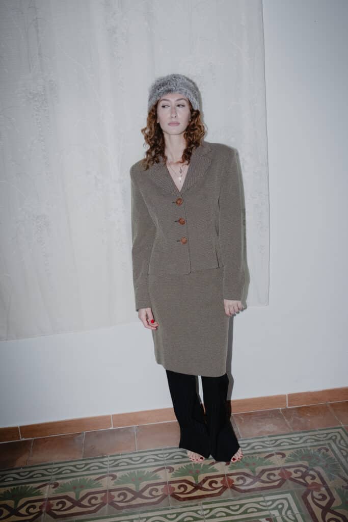 tailored wool blazer featuring curved seams and notched lapels