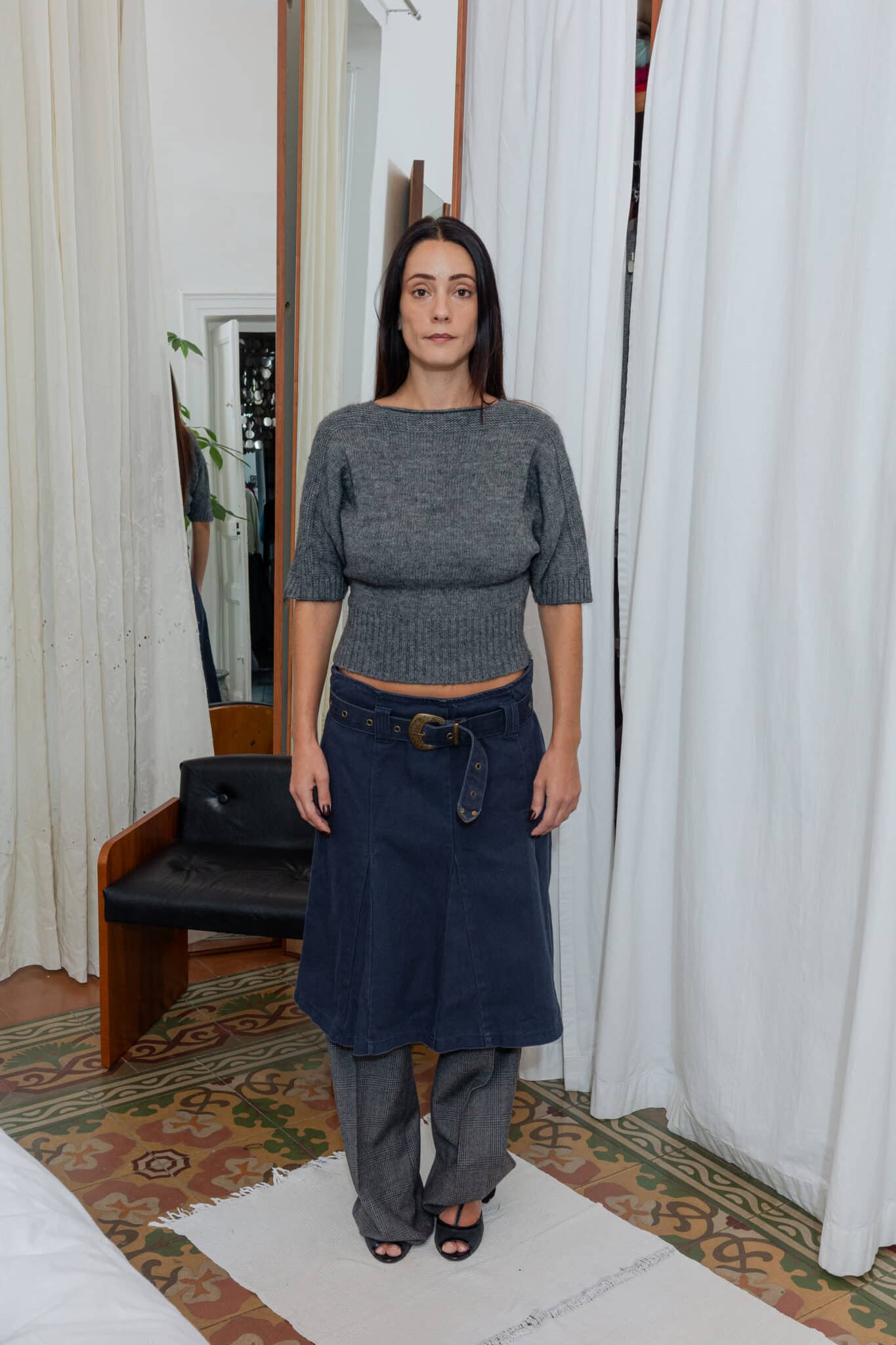 Outfit featuring textured knit and layered tailoring.