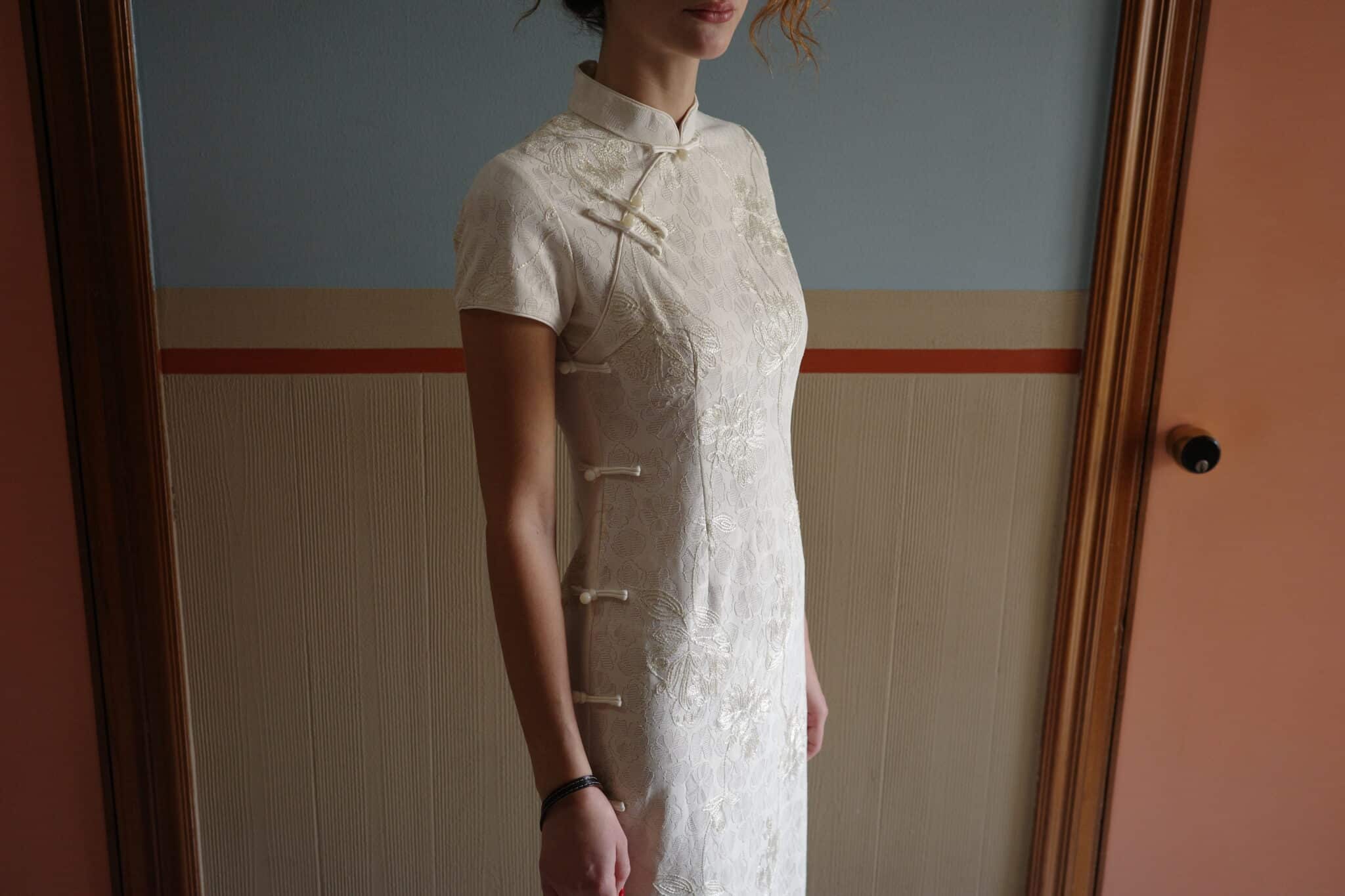 White cheongsam midi dress crafted in floral jacquard with a clean, fitted silhouette