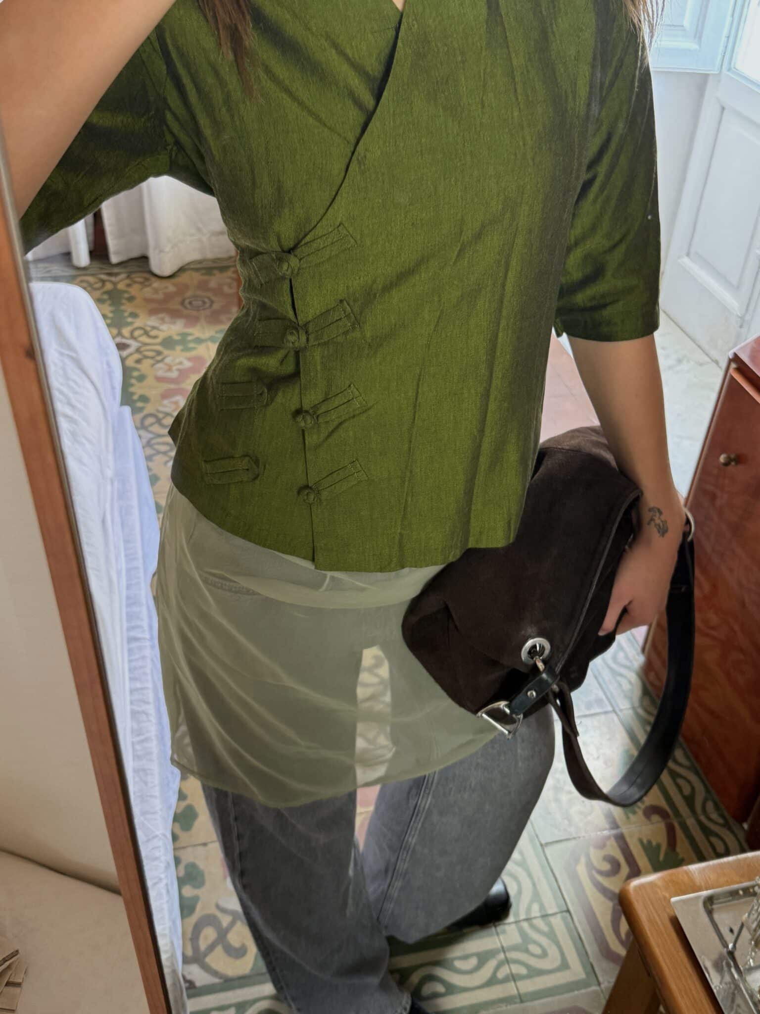 Front view of layered green slip dress worn over a light green underdress, featuring a straight silhouette.