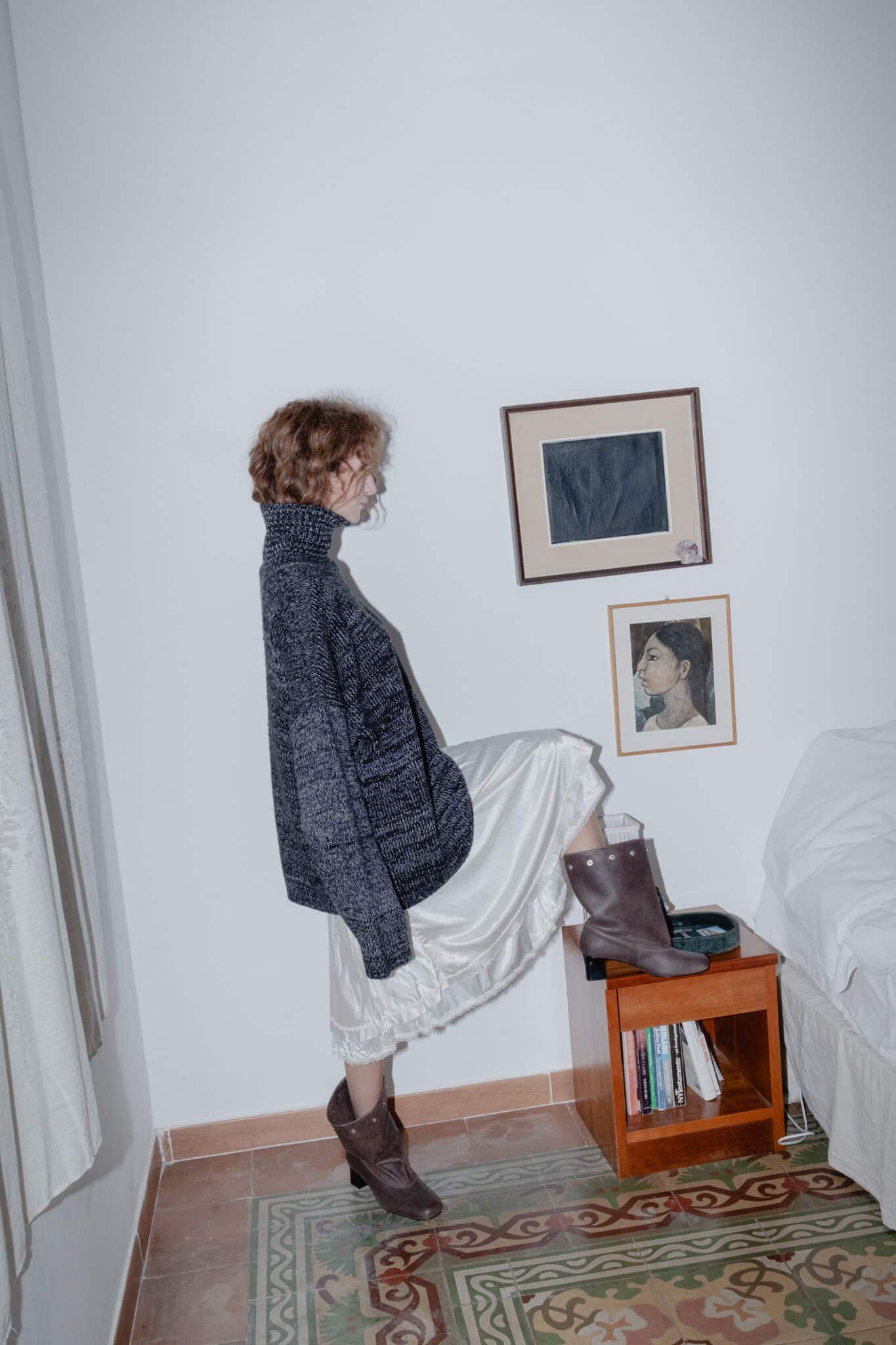 Deep-toned oversized wool sweater styled over a flowing silky skirt.