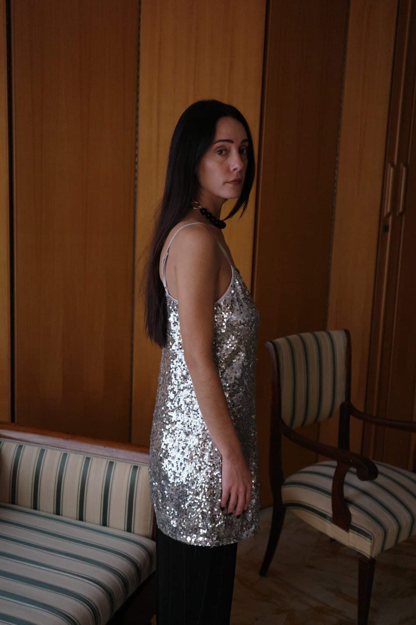 Relaxed-fit silver sequin top styled with black trousers