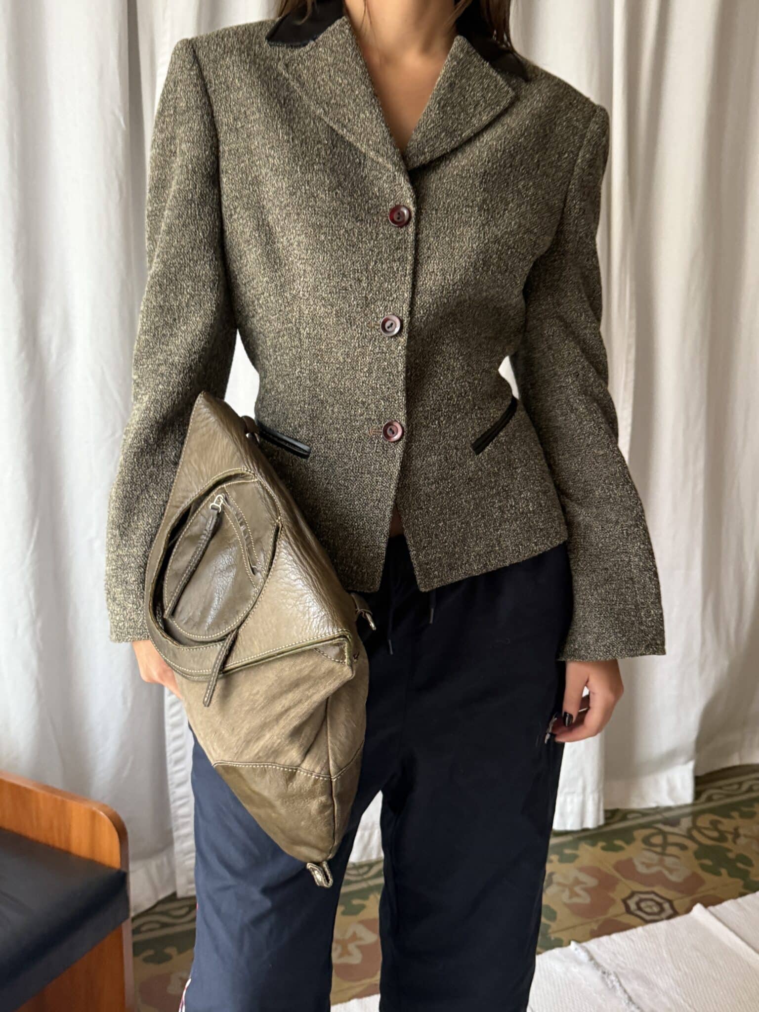 Classic brown shoulder bag with minimal design and soft sheen.